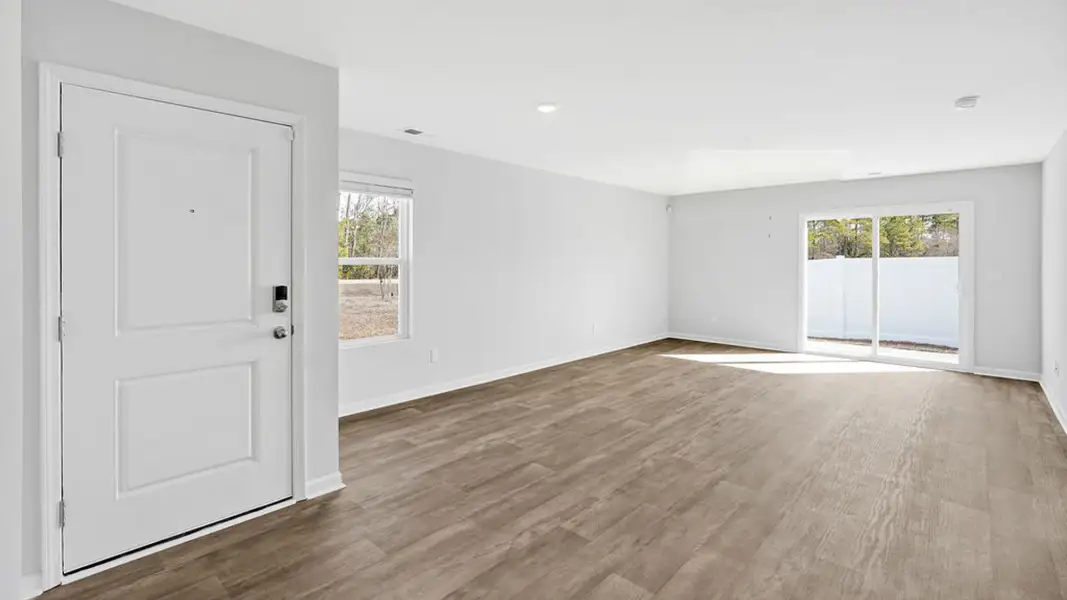 Representative unfurnished interior of a home built from the BAYSHORE by D.R. Horton in Indigo Preserve Townhomes, Leland (Image 13).