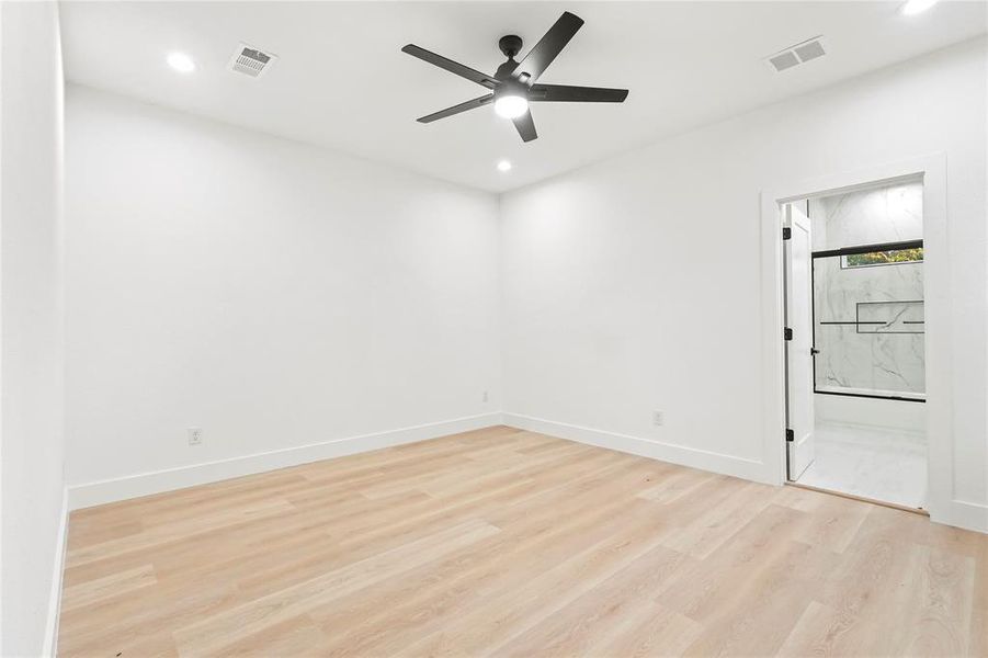 Empty room with light wood-type flooring, recessed lighting, and ceiling fan Empty room with light wood-type flooring, recessed lighting, and ceiling fan