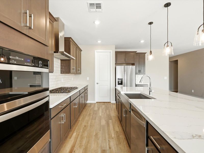 Furnished interior view inside a new home in White Tank Foothills Signature Series, Waddell (Image 4).