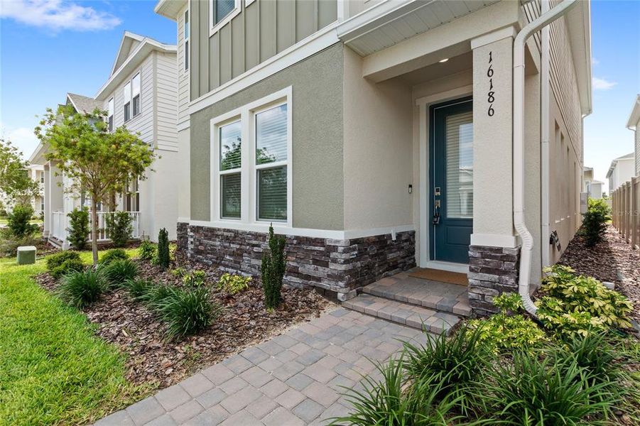 Exterior details and patio area of a home in Harvest at Ovation, Winter Garden (Image 3).