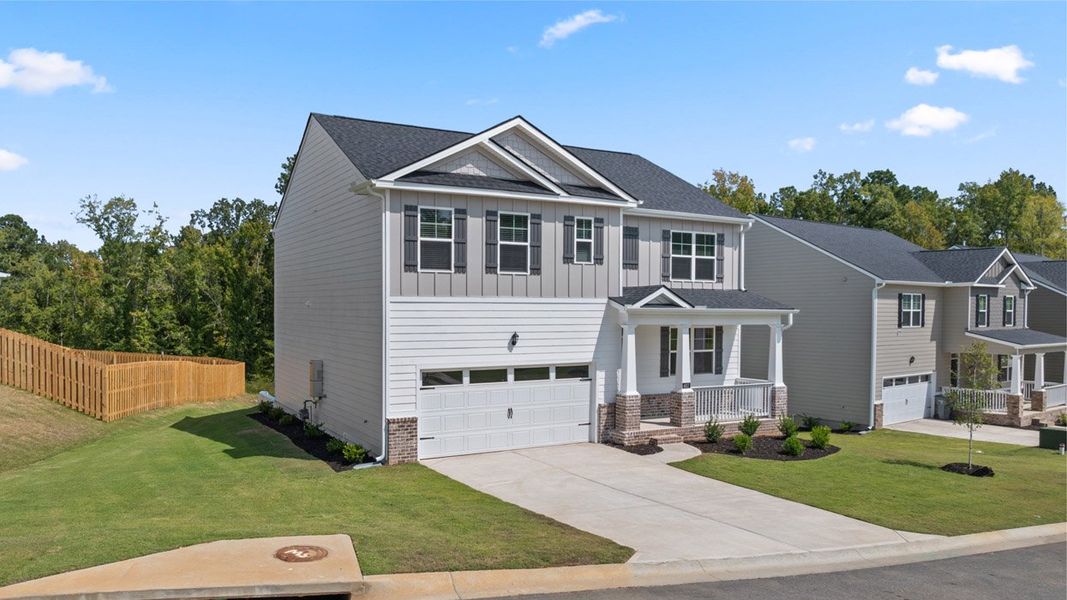 Front exterior of a new home in Southwind Village, Evans, GA, highlighting curb appeal (Image 24). Front exterior of a new home in Southwind Village, Evans, GA, highlighting curb appeal (Image 24).