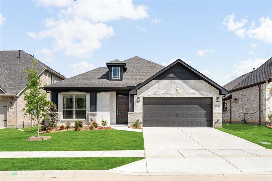 Front exterior of a new home in Creekview Meadows, Pilot Point, TX, highlighting curb appeal (Image 2).