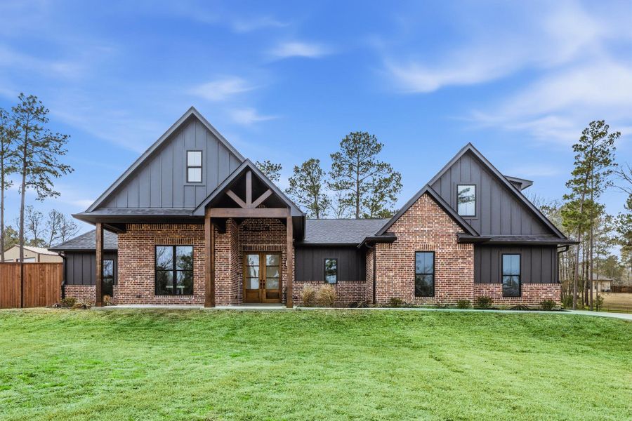 Front exterior of a new home in , Huntsville, TX, highlighting curb appeal (Image 26).