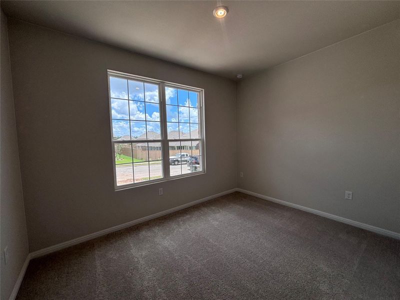 Spacious, unfurnished interior of a new home in The Colony, Bastrop (Image 9).