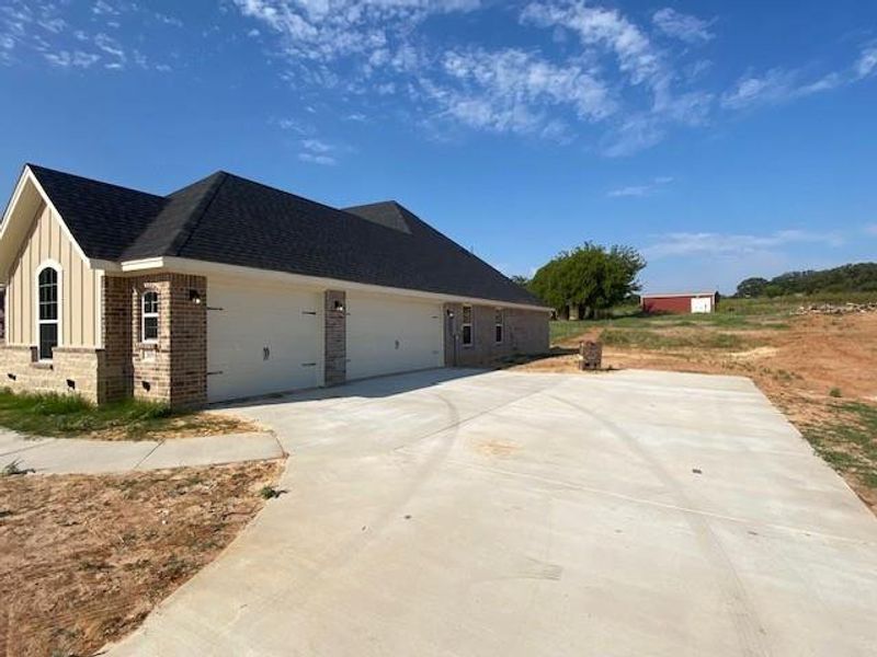 Front exterior of a new home in , Reno, TX, highlighting curb appeal (Image 1). Front exterior of a new home in , Reno, TX, highlighting curb appeal (Image 1).
