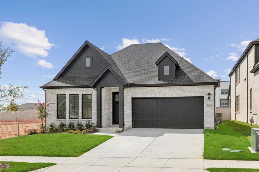 Featuring light colored brick with striking dark accents, this dream home offers fantastic curb appeal! Featuring light colored brick with striking dark accents, this dream home offers fantastic curb appeal!
