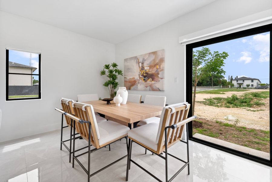 Representative furnished interior of a home built from the Model E by Onx Homes in On Alba, Florida City (Image 39).