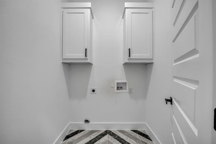 Laundry room with washer hookup, cabinets, hookup for a gas dryer, and hookup for an electric dryer