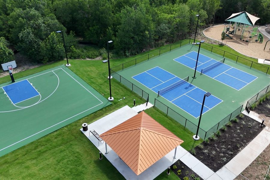Aerial photo of community sports courts with trees