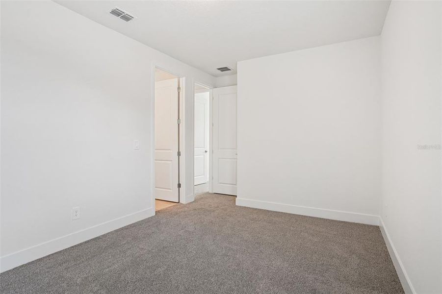 Spacious, unfurnished interior of a new home in Ridgehaven - Signature Series, Ormond Beach (Image 40).