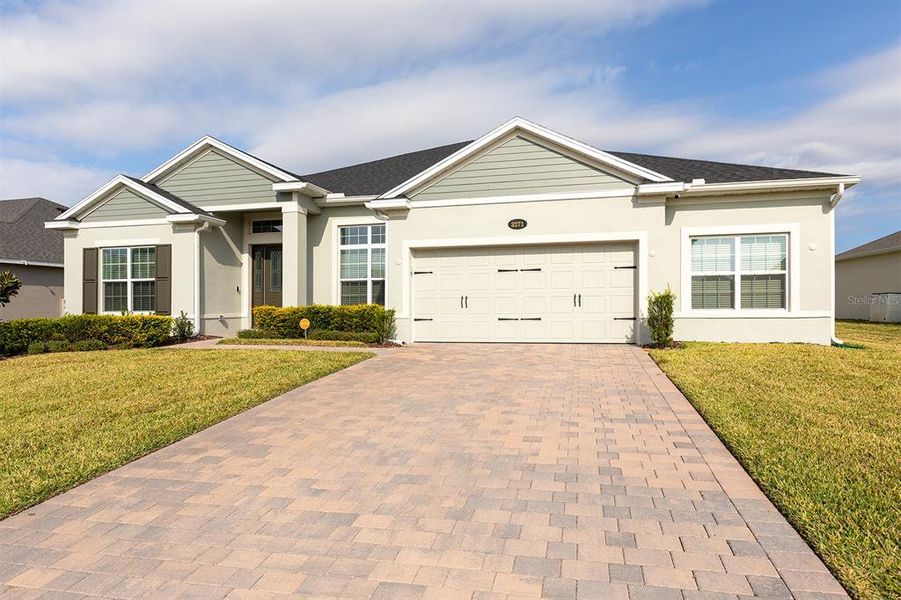 Front exterior of a new home in Wolf Lake Ranch, Apopka, FL, highlighting curb appeal (Image 2).