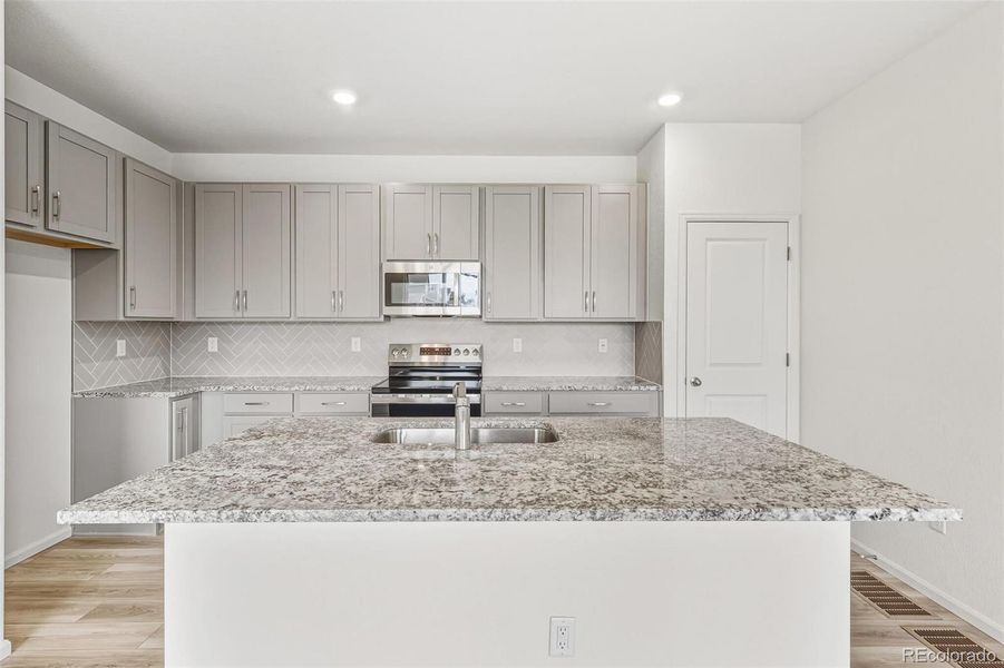 Furnished interior view inside a new home in Sky Ranch Villas, Watkins (Image 9).