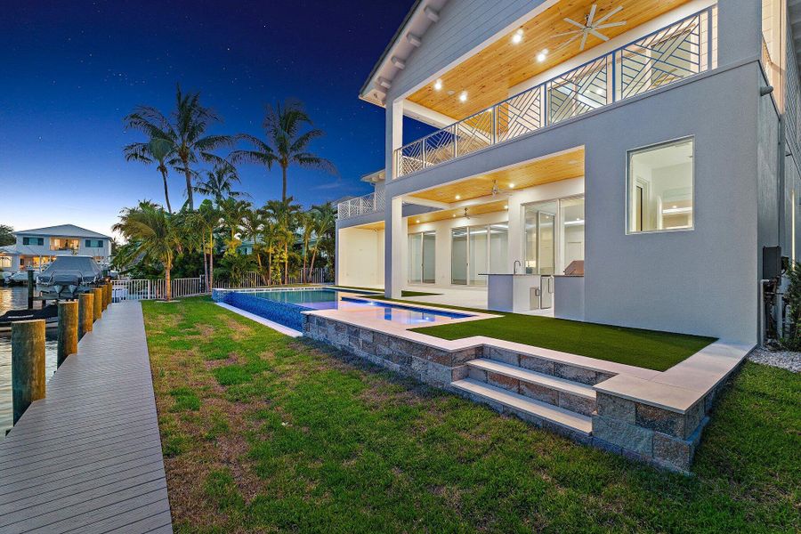 Front exterior of a new home in , Tequesta, FL, highlighting curb appeal (Image 27). Front exterior of a new home in , Tequesta, FL, highlighting curb appeal (Image 27).