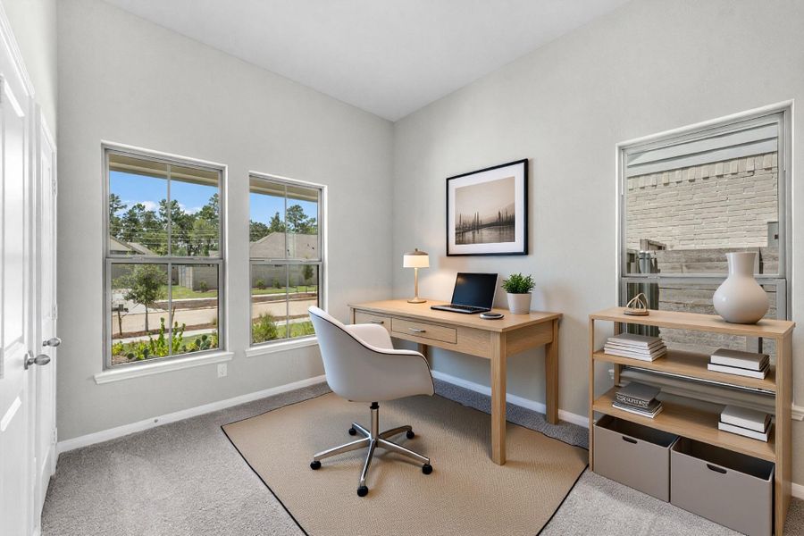 A private home office/flex room on the first level. Virtually staged.
