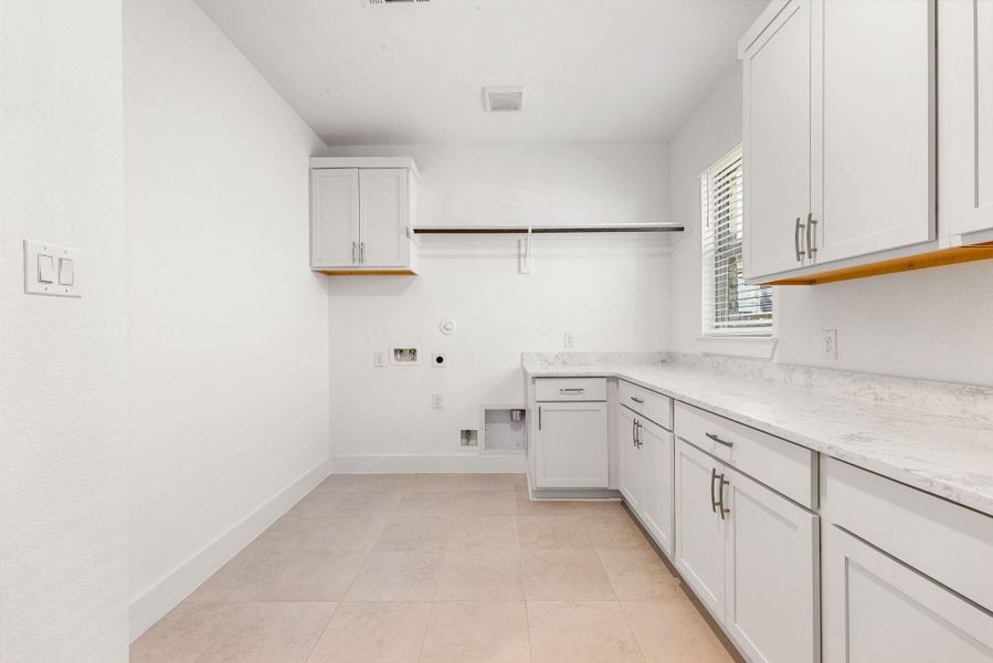 Huge walk in laundry room with tons of storage