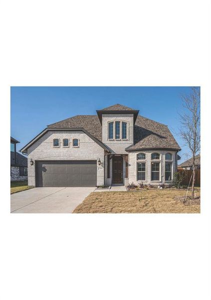 View of front of property with a garage