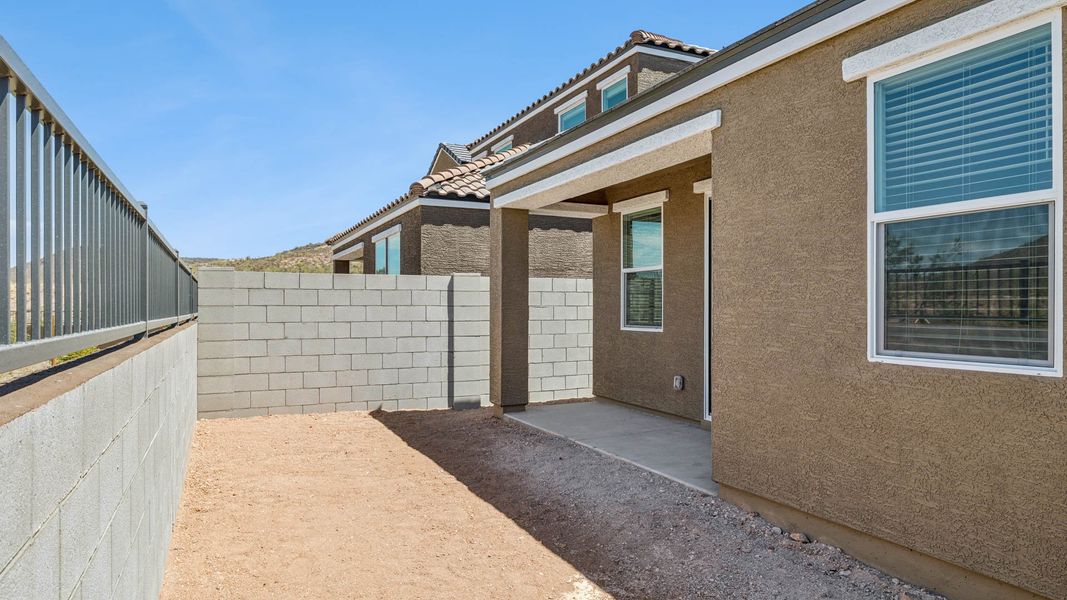 Exterior details and patio area of a home in The Buttes at Mystic, Peoria (Image 2). Exterior details and patio area of a home in The Buttes at Mystic, Peoria (Image 2).