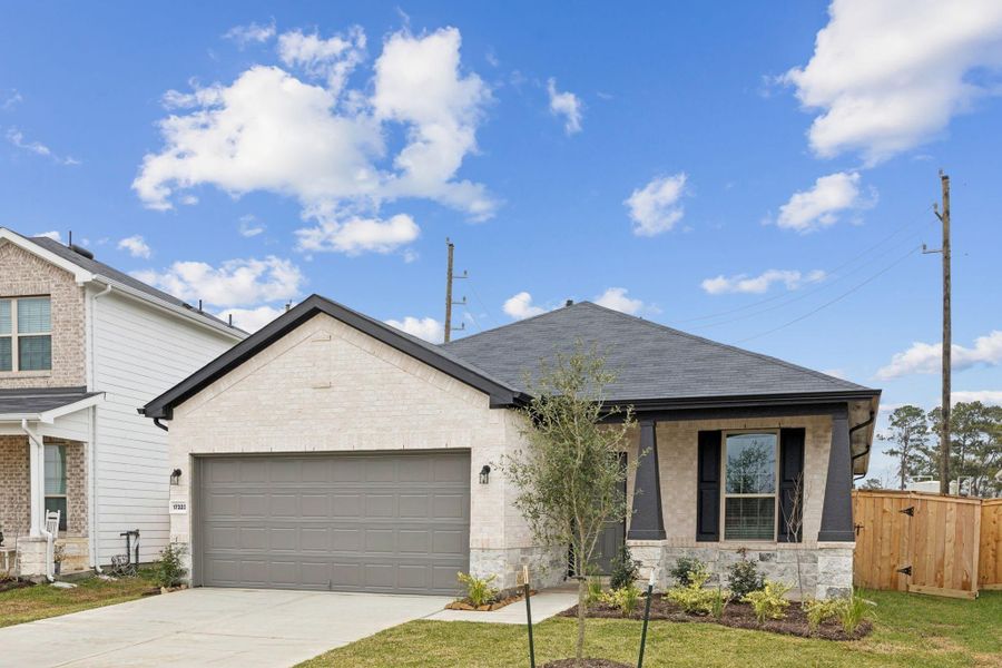 Front exterior of a new home in Crosby Farms, Crosby, TX, highlighting curb appeal (Image 2).