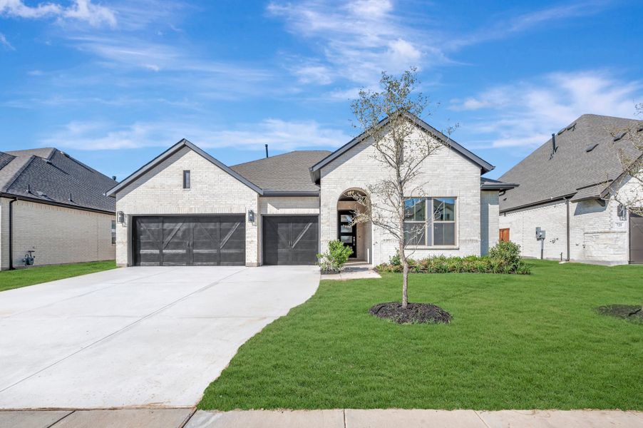 Front exterior of a new home in Myrtle Creek, Waxahachie, TX, highlighting curb appeal (Image 1). Front exterior of a new home in Myrtle Creek, Waxahachie, TX, highlighting curb appeal (Image 1).