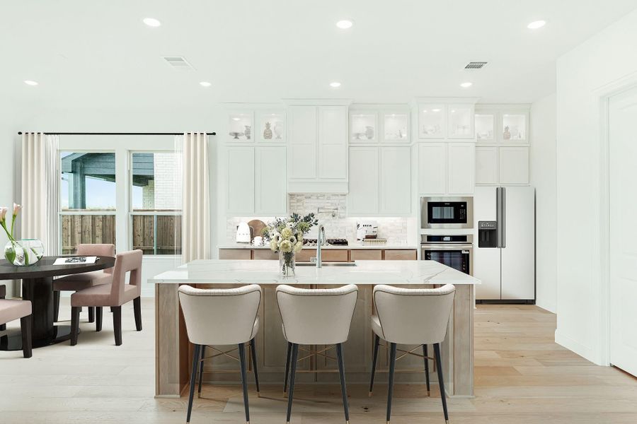 Open kitchen with white cabinets, large island with three bar stools, and stainless steel appliances on light hardwood floors