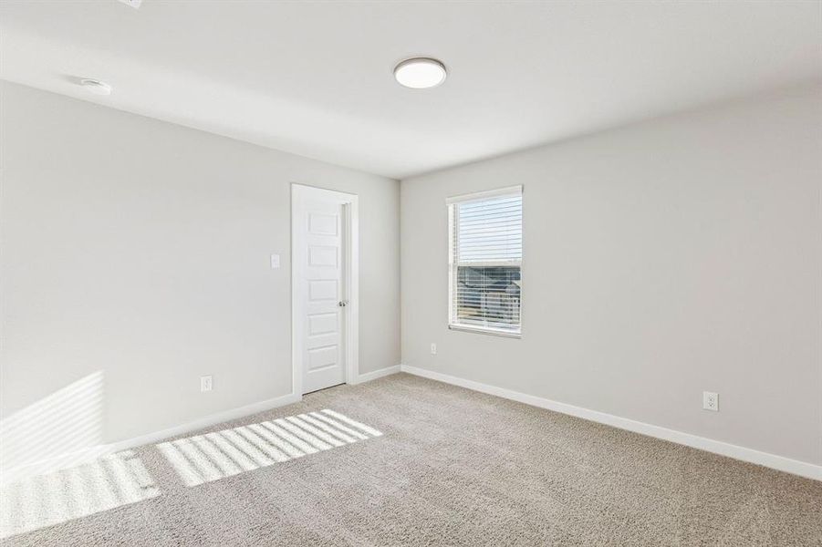 Bedroom in the Haylee home plan by Trophy Signature Homes - REPRESENTATIVE PHOTO