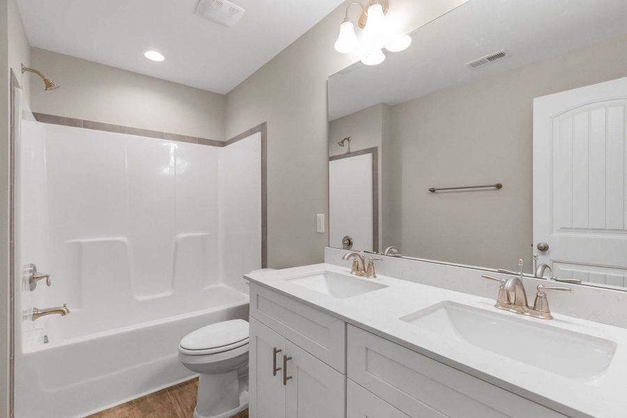 Representative furnished interior of a home built from the Aberdeen by Caviness & Cates Communities in Bartlett Manor, Youngsville (Image 198).