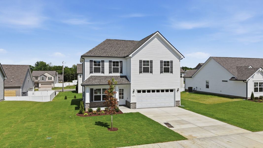 Front exterior of a new home in Wheatfield, Shelbyville, TN, highlighting curb appeal (Image 18).