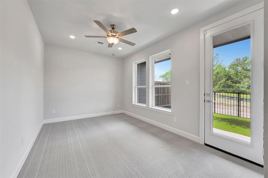 Interior space featuring light gray walls and patterned carpet flooring