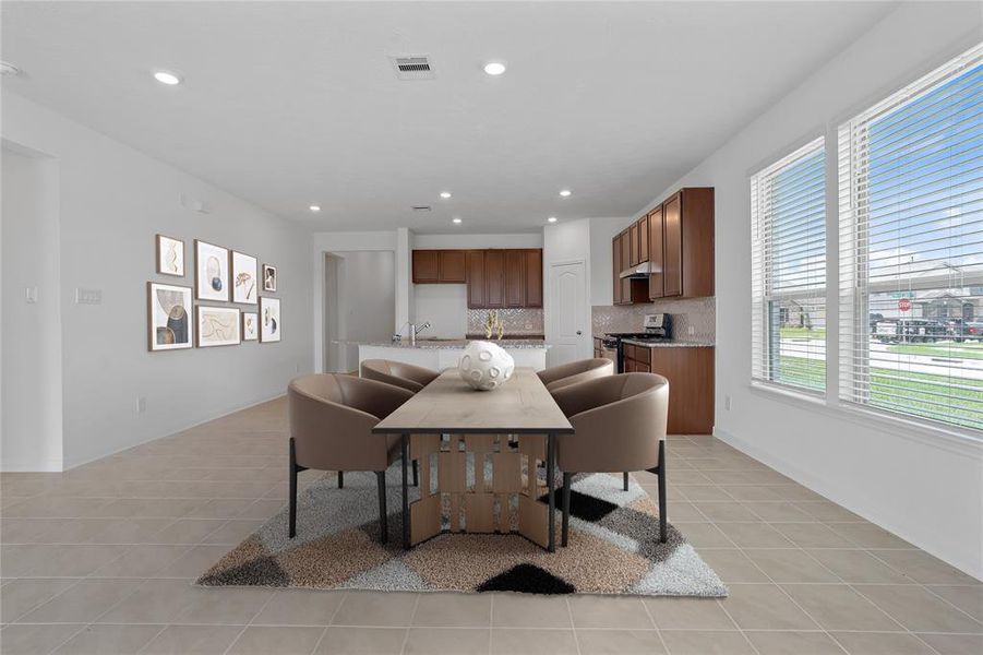 Start your day off right with a cup of coffee sitting with your family in the lovely breakfast area! Featuring large windows, custom paint, tile flooring, recessed lighting and large windows with privacy blinds.