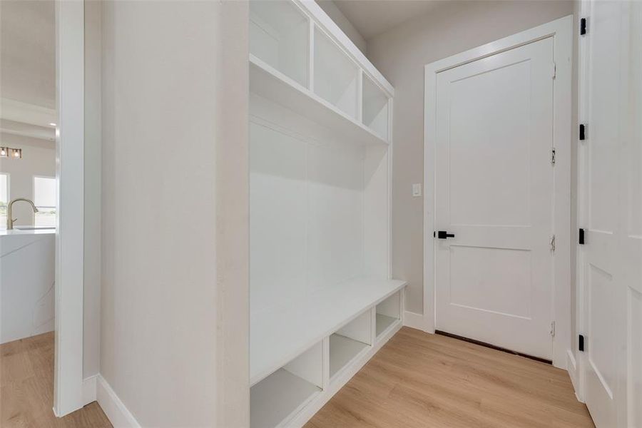 Mudroom with light wood-type flooring