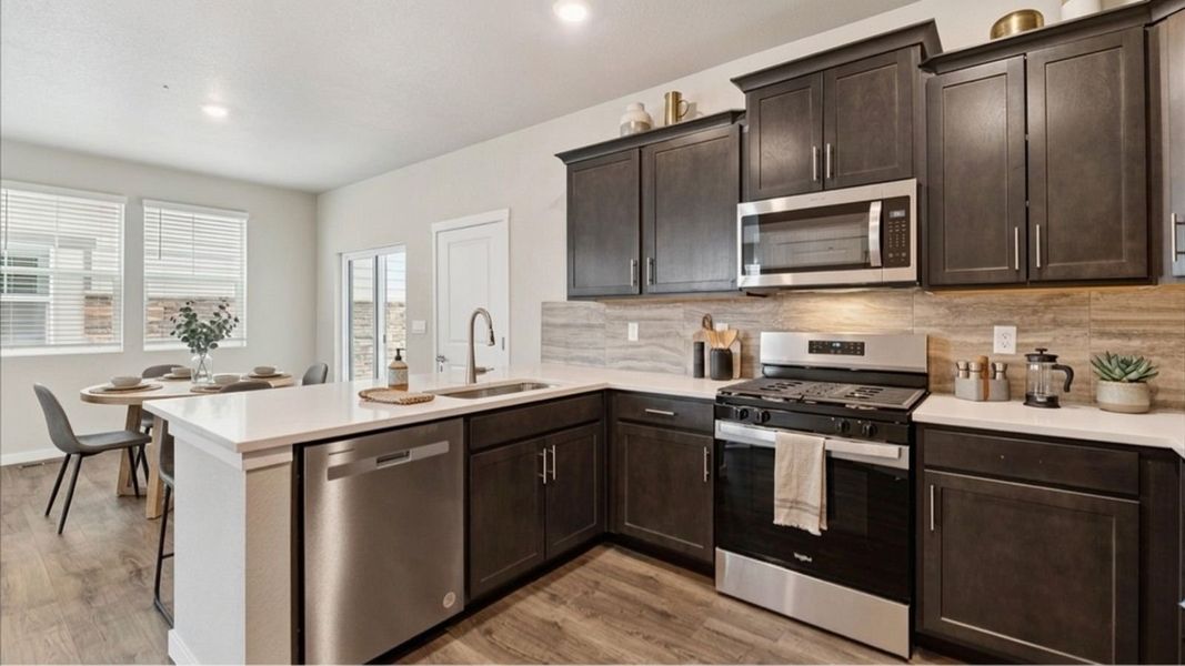 Representative furnished interior of a home built from the Douglas by D.R. Horton in Horizon Uptown, Aurora (Image 5).