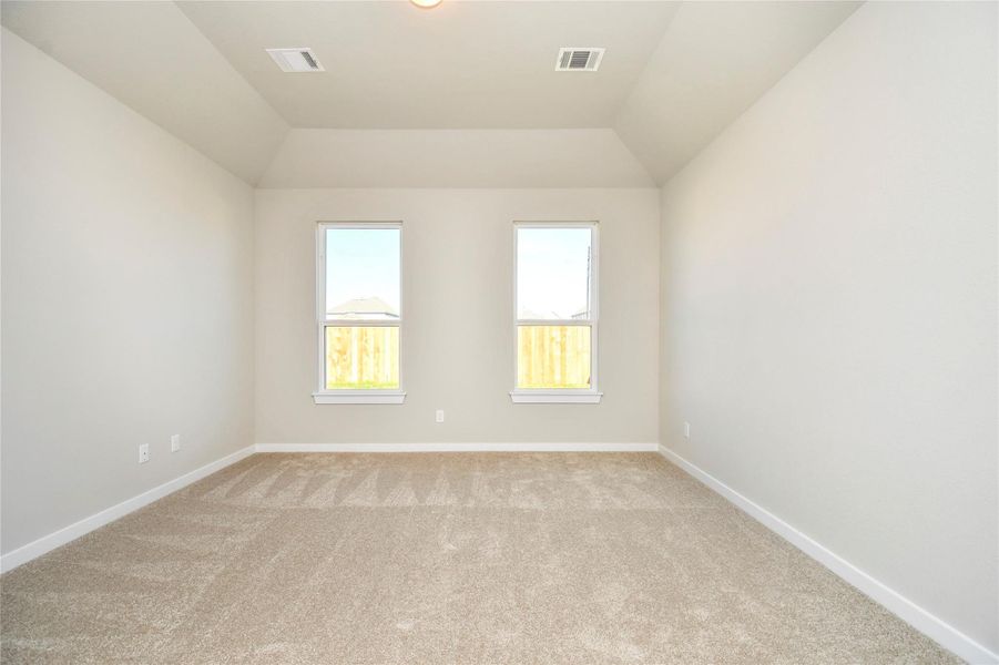 Come and unwind after a long day in this magnificent primary suite! This spacious roomfeatures plush carpet, warm paint, high ceilings and large windows with privacy blinds. Sample photo of completed home with similar floor plan. Actual colors and selections may vary.