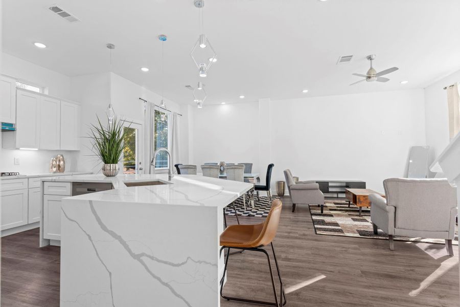 Open-concept layout combining the kitchen, dining, and living areas for seamless entertaining. Open-concept layout combining the kitchen, dining, and living areas for seamless entertaining.
