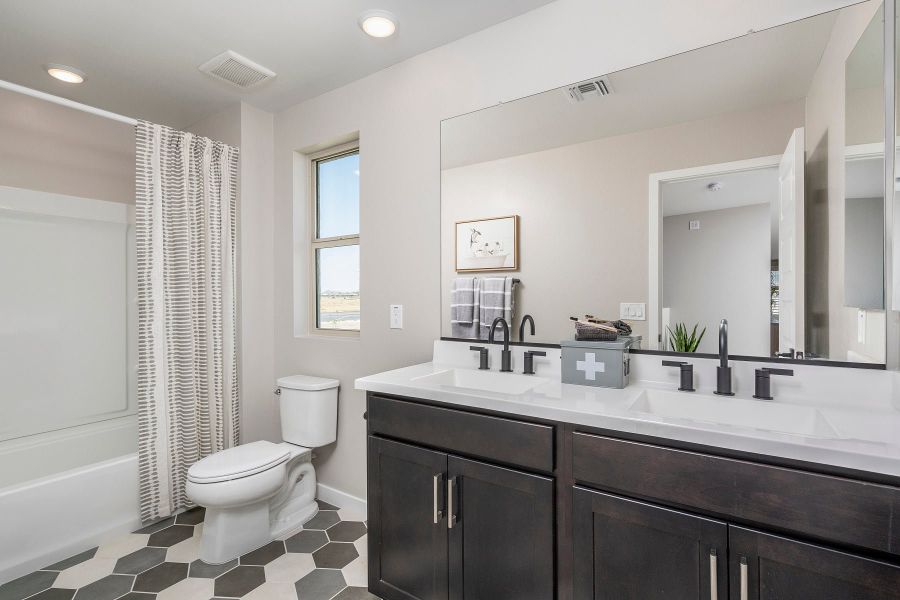 Representative furnished interior of a home built from the Grand by Risewell Homes in Bentridge, Buckeye (Image 14).