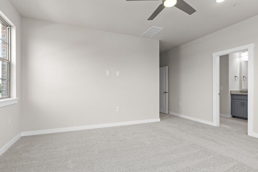 Spacious, unfurnished interior of a new home in The Tribute, The Colony (Image 40).