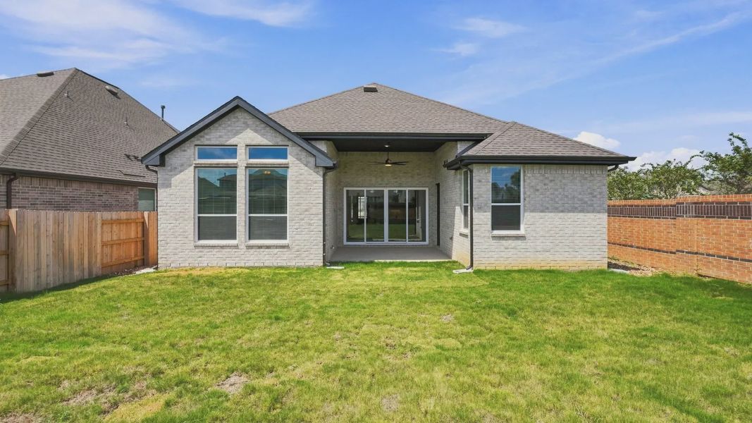 Exterior details and patio area of a home in Elyson 50's, Katy (Image 19).