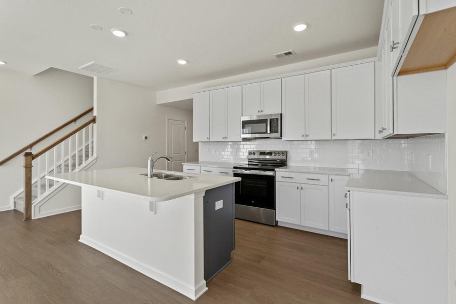 Furnished interior view inside a new home in Bellevue Townhomes, Greenville (Image 7). Furnished interior view inside a new home in Bellevue Townhomes, Greenville (Image 7).