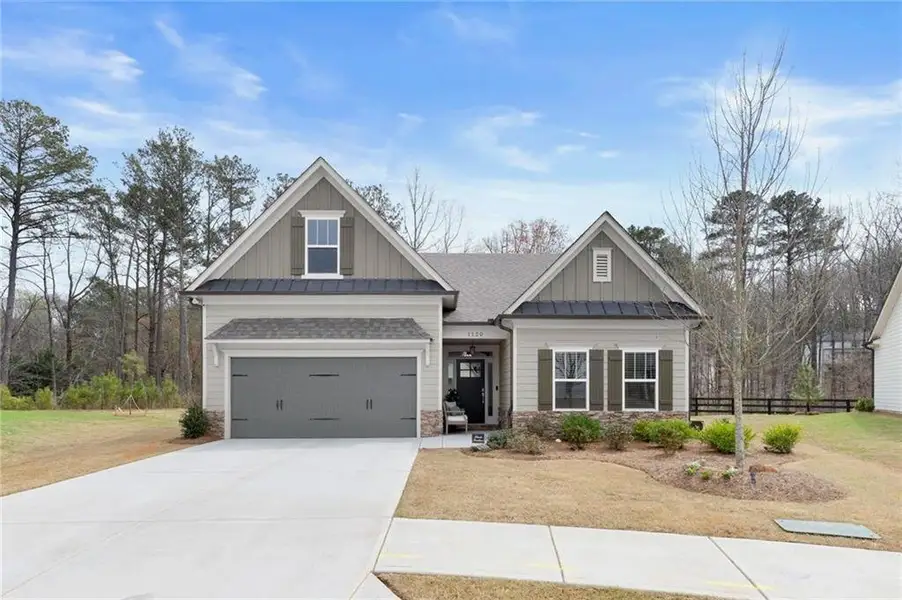 Front exterior of a new home in , Woodstock, GA, highlighting curb appeal (Image 25).