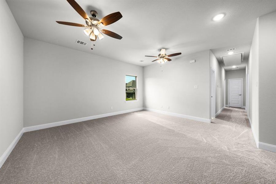 Empty room with light carpet, ceiling fan, attic access, and recessed lighting Empty room with light carpet, ceiling fan, attic access, and recessed lighting