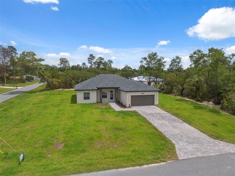 Front exterior of a new home in , Ocala, FL, highlighting curb appeal (Image 2).