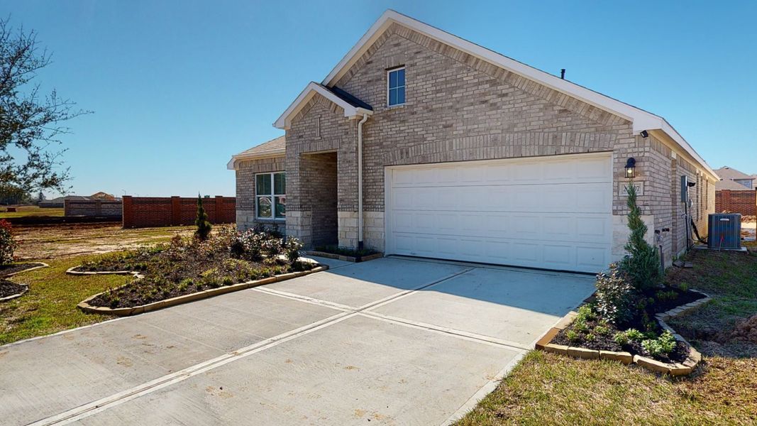 Representative exterior photo of a completed home built from the Floor Plan 2121 by Colina Homes in Grand Magnolia, Magnolia, TX (Image 1). Representative exterior photo of a completed home built from the Floor Plan 2121 by Colina Homes in Grand Magnolia, Magnolia, TX (Image 1).