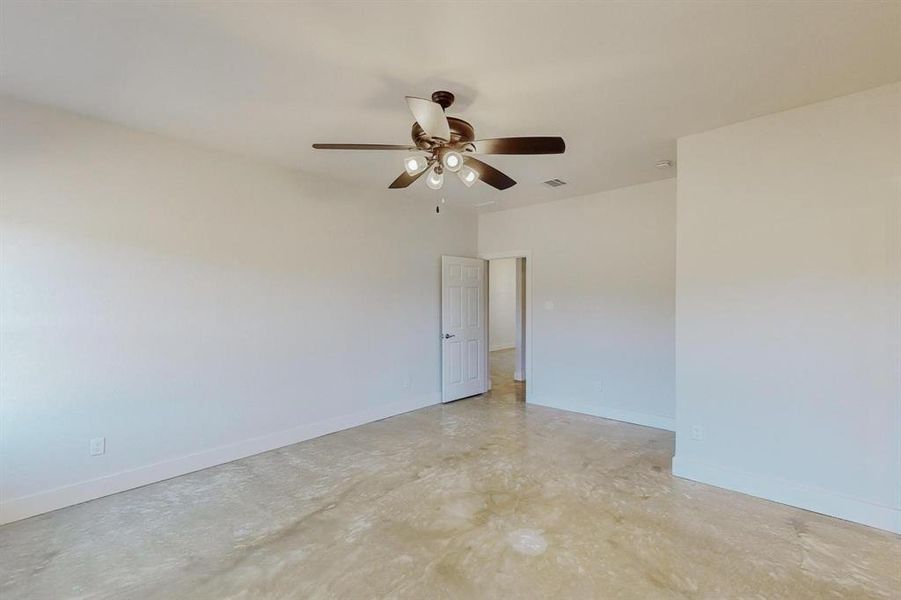 Spare room with ceiling fan