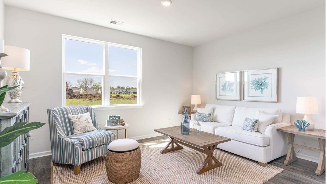 Representative furnished interior of a home built from the CALI by D.R. Horton in Eden Springs, Longs (Image 19).
