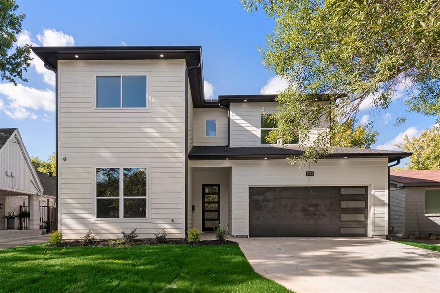 View of front of property with a front lawn