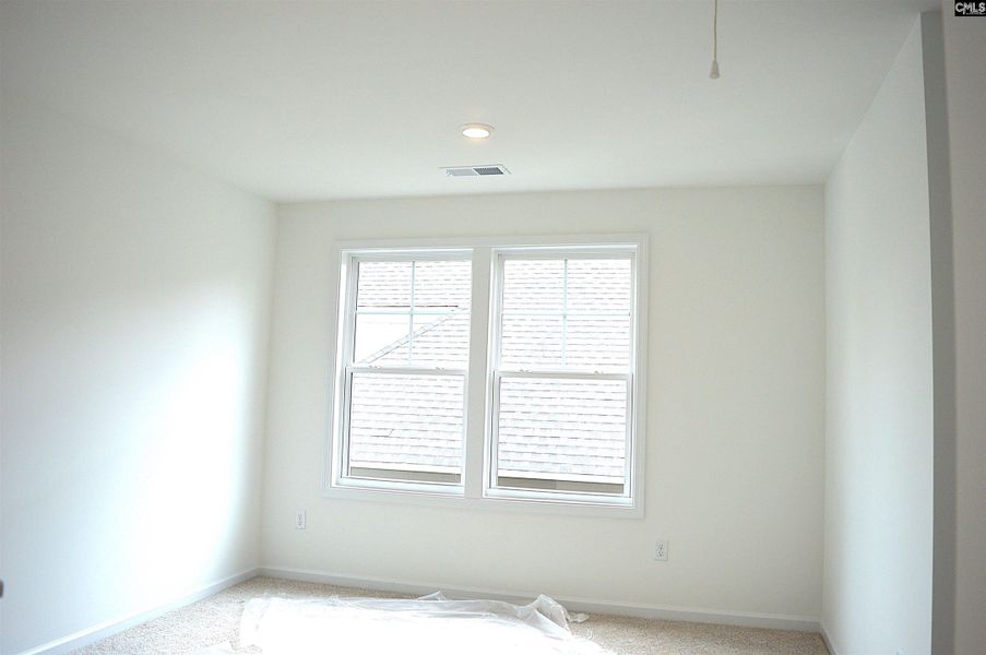 Spacious, unfurnished interior of a new home in Bickley Station, Irmo (Image 13).