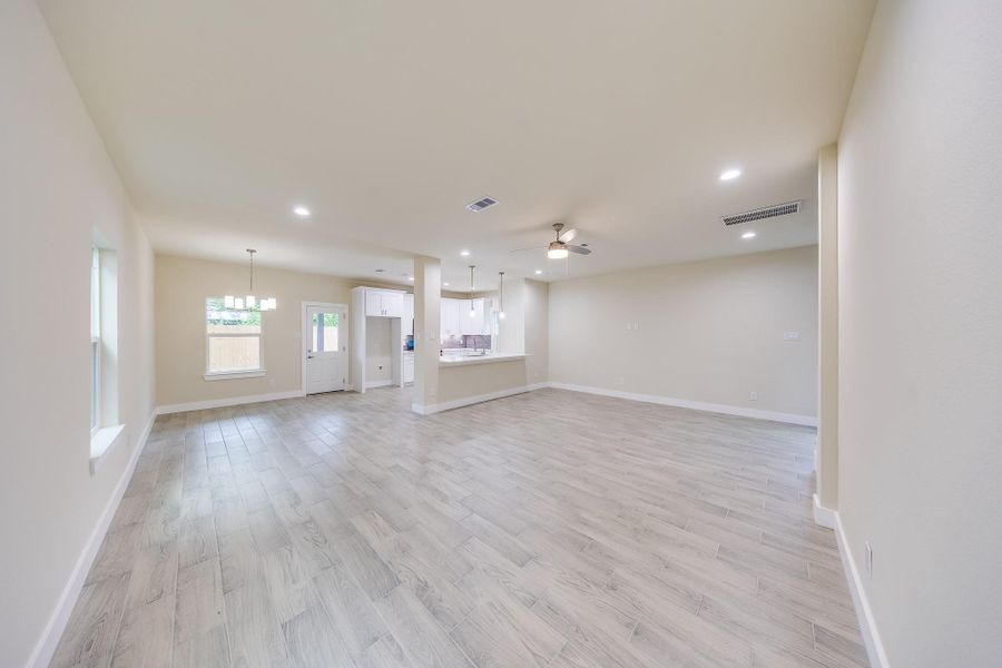 Bright living room filled with natural light from large windows, creating a warm and inviting atmosphere. Bright living room filled with natural light from large windows, creating a warm and inviting atmosphere.