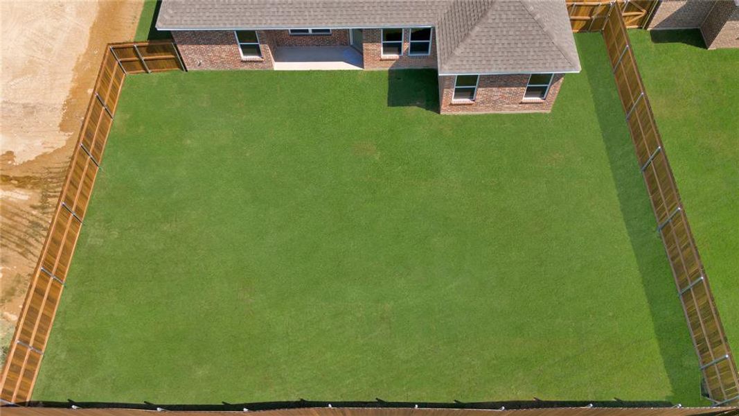 Spacious lots are fenced with full sprinkler system