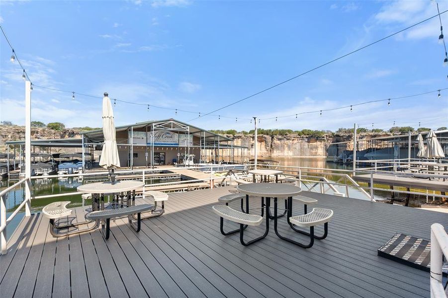 Deck featuring a water view and a boat dock