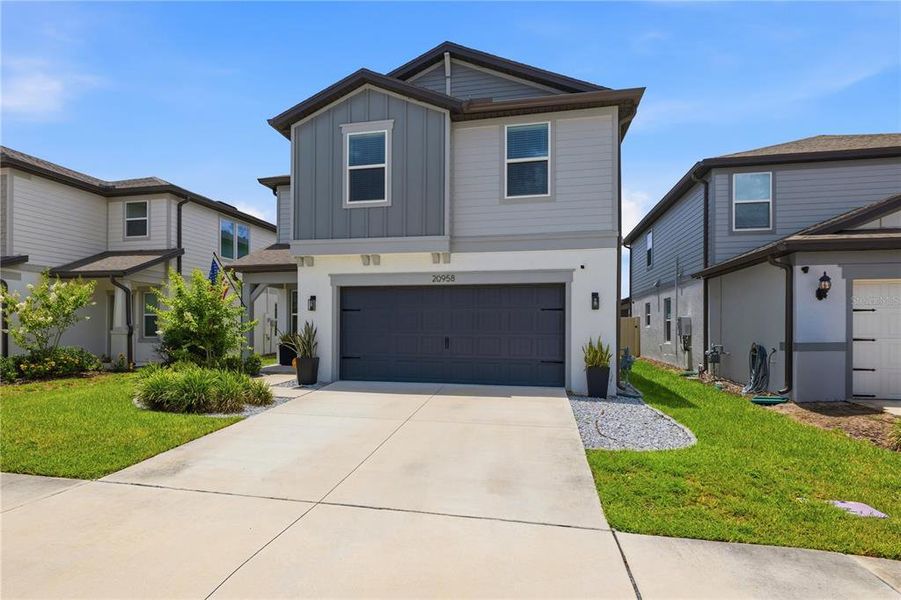 Front exterior of a new home in , Land O' Lakes, FL, highlighting curb appeal (Image 23). Front exterior of a new home in , Land O' Lakes, FL, highlighting curb appeal (Image 23).
