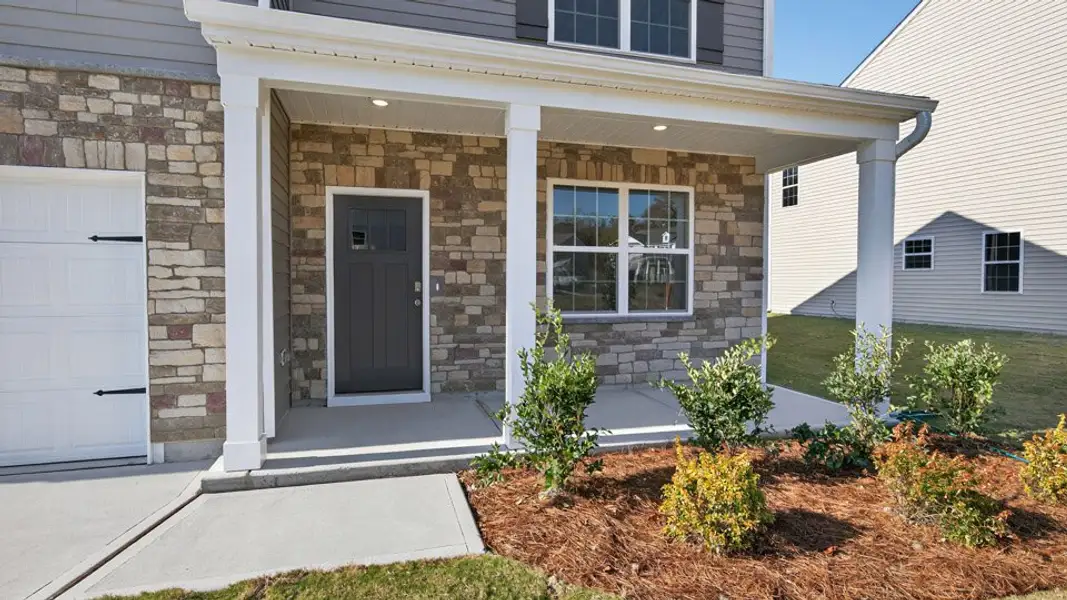 Exterior details and patio area of a home in Lawson Glen, Clayton (Image 2). Exterior details and patio area of a home in Lawson Glen, Clayton (Image 2).